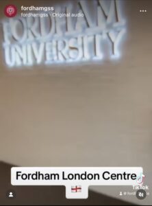 sign at the fordham london centre that says fordham university. there is text under that says "fordham london centre" with an image of england's flag