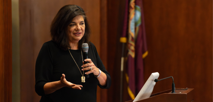 Shirley Gatenio Gabel speaking into a microphone.