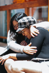 two people hugging.