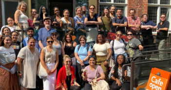 this year's cohort of students pose for a photo outside of Oxford House