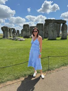 pam gawley poses near stonehenge