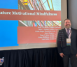 (left to right) JoAnne McMahon, Henry Davis, and Laura Sutter pose in front of their presentation at the conference