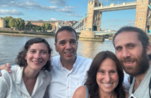 pam gawley poses with three others in front of London's tower bridge