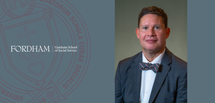 "Portrait of Gregory Acevedo wearing a dark suit, white shirt, and striped bow tie, smiling softly, set against a neutral background with the Fordham Graduate School of Social Service logo and seal on the left side."