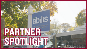 a photo of the abilis organization sign with "partnership spotlight" overlayed in the text. 